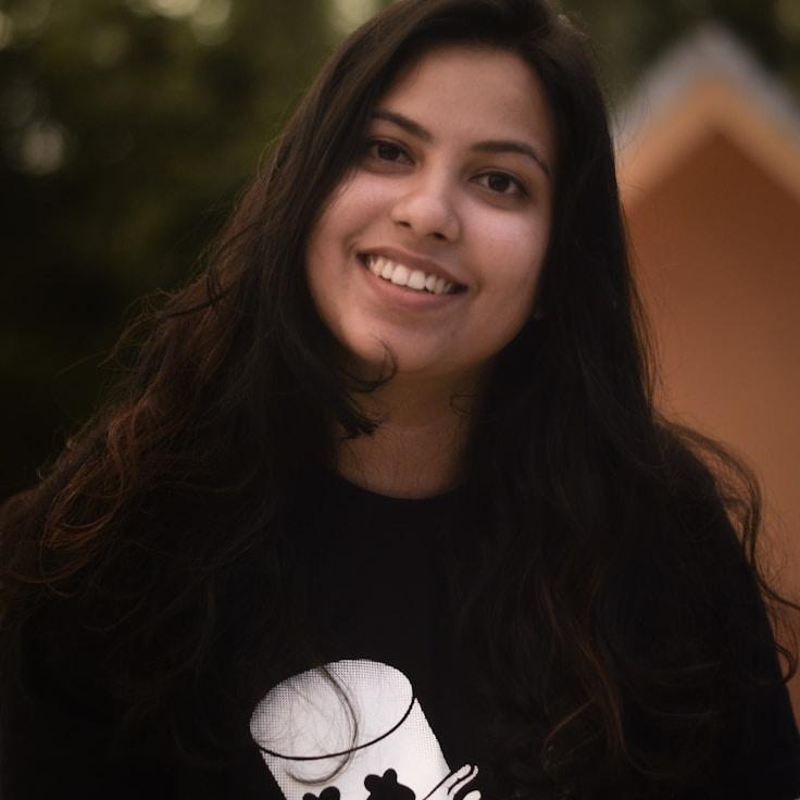 Kaveri Mehta, Lead Design Curator at BalancedOriginFramework, reviewing corporate floral arrangements